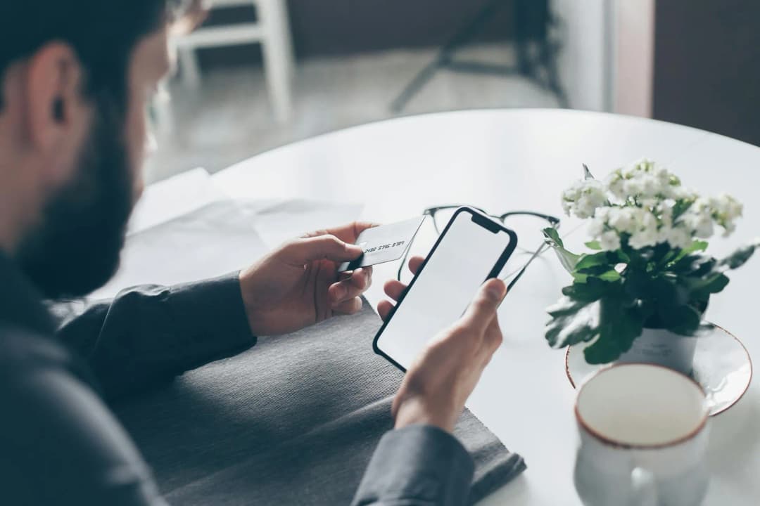 Person using mobile banking app on smartphone