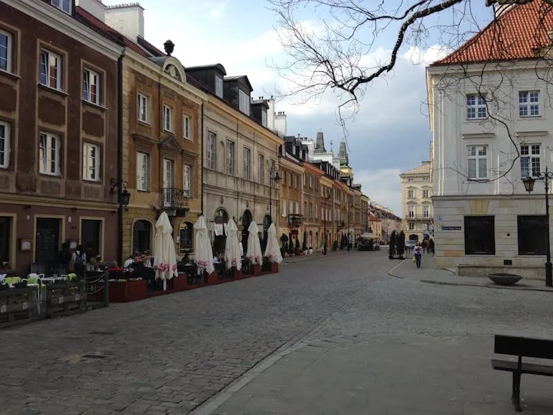 Street with outdoor cafes in Warsaw Old Town, Poland